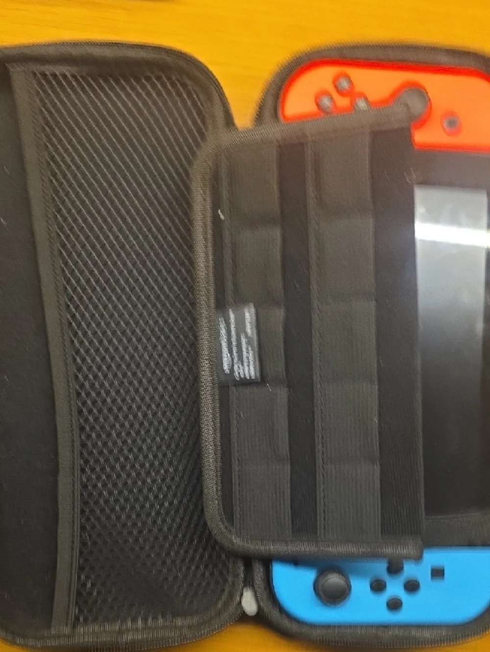 Nintendo Switch with Red and Blue Joy-Con Controllers